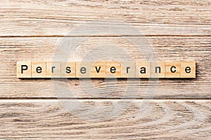 Perseverance word written on wood block. perseverance text on table, concept