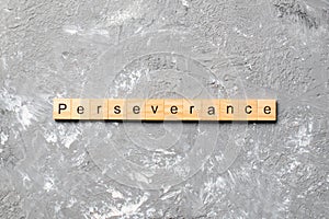 Perseverance word written on wood block. perseverance text on table, concept
