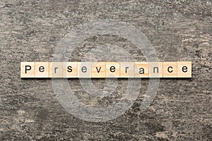 perseverance word written on wood block. perseverance text on table, concept