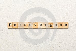 perseverance word written on wood block. perseverance text on table, concept