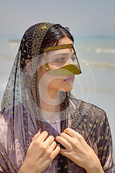 Persian girl in traditional islamic mask of southern Iran, portrait.
