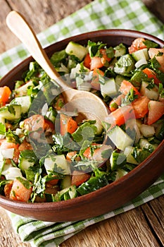 Persian Shirazi vegetable salad closeup on a plate. vertical