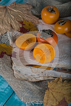 Persimmon fruit on a sackcloth.