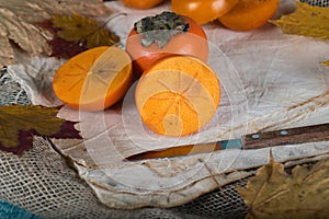 Persimmon fruit on a sackcloth.