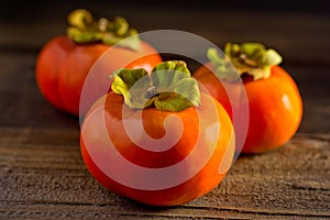 Persimmons Three on a Plank photo