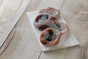 Persimmons on wooden tray