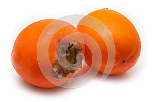 Persimon or sharon fruit on a white studio background.