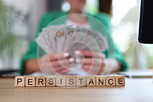 Persistence word collected with wooden cubes in row