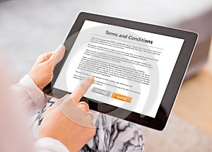 Person accepting terms and conditions on tablet