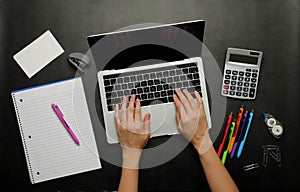 The person analyzing financial data.office and study stationery with a laptop for online work and back to school