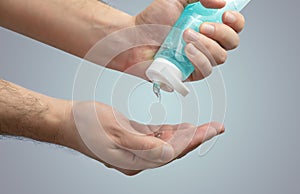 Person applying hand sanitiser gel to kill bacteria and disease - Close up of hands washing and cleansing with hygienic