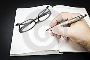 A person beginning to write