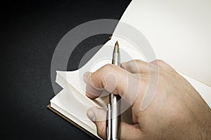 A person beginning to write