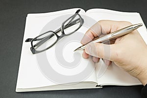 A person beginning to write