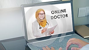 Person browsing to online doctor website or app while staying at home. Close up of patient in video conferencing with general