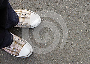 Person in casual check shoes