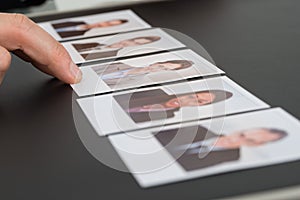 Person choosing photograph of a candidate