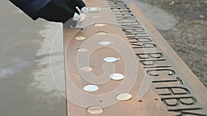 Person choosing russian commemorative coins