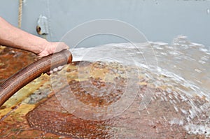 Person cleaning boat