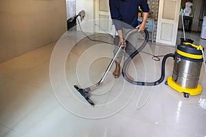 The person  cleaning floor with professional equipment in the living room.. cleaning concept