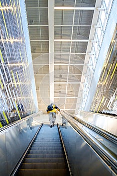 Person climbing stairs in modern environment