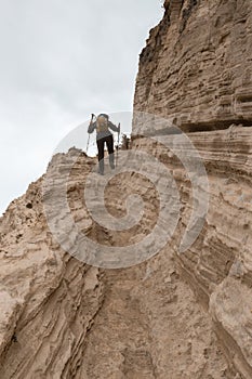 Person climbing a stone mountain