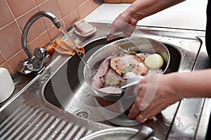 Person cooking of russian meat aspic