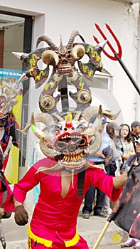 Person in a creepy clown mask at the Diablada