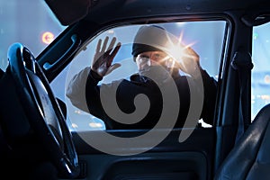 Person,criminal breaking into car at dawn, night