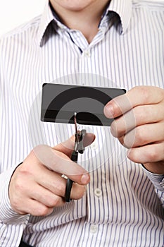 Person cutting a Credit Card