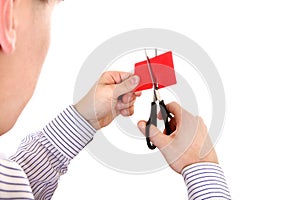 Person cutting a Credit Card