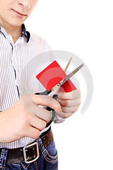 Person cutting a Credit Card