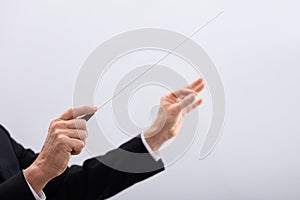 Person Directing With Conductors Baton