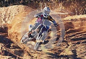 Person, dirt track and professional motorcyclist on bike for extreme sports, competition or outdoor race. Expert rider