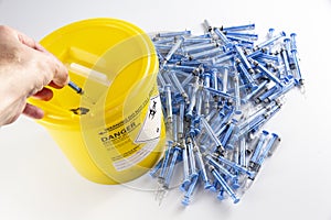 Person disposing of glatiramer acetate syringe