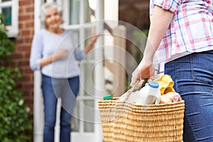 Person Doing Shopping For Elderly Neighbour