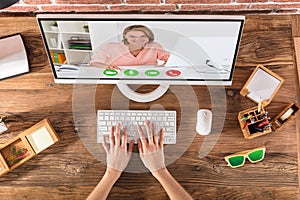 Person Doing Video Conference With A Woman On Computer