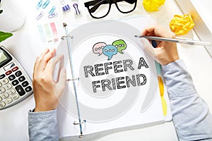 Person drawing Refer A Friend concept