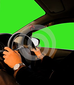 Person Driving a car with green screen on wind screen and door window backdrop.