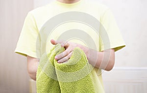 a person drying hands with towel in bathroom, washing dirty hands