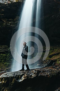 Person enjoying the Sougahogdee Falls in Bankhead National Forest