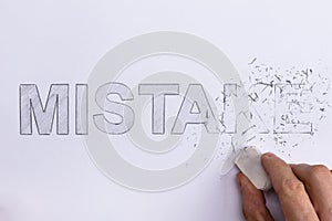 Person Erasing Mistake Word