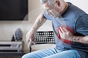 A person experiences chest pain caused by a heart attack. Heart disease. Angina pectoris. The concept of health insurance for the