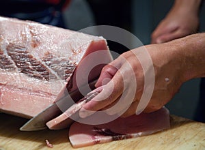 Person filleting fish photo