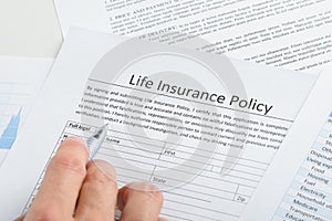 Person filling application for life insurance