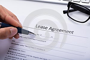 Person Filling Lease Agreement Form