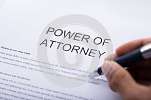 Person Filling Power Of Attorney Form