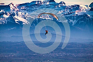 a person flying through the sky with a parasail