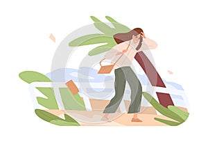 Person going while gust of strong wind blowing. Bad gusty and windy weather concept. Woman wading outdoors in windstorm