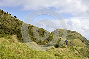 Person going up an old crater rim on São Jorge island in the Azores